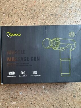 Cotsoco silver and black handheld massage gun with attachments